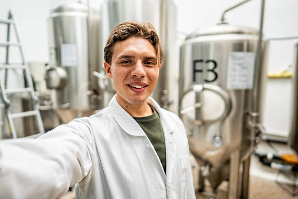 istock Young man taking selfie in a brewery - camera point of view 2213876890