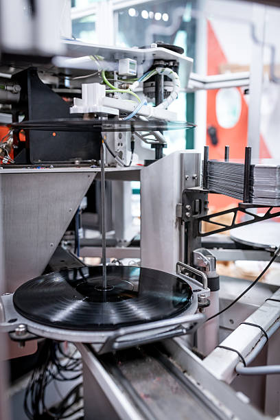 istock Vinyl record press factory machinery 2213878455