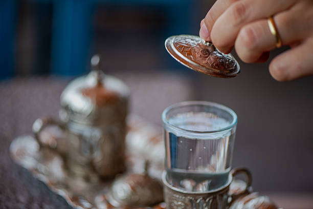 istock Traditional Turkish Copper Coffee Cup on Ancient Stone, Lid Opening 2213880145