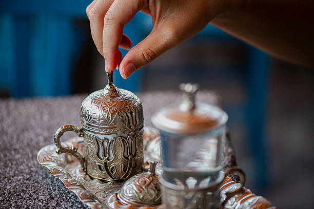 istock Traditional Turkish Copper Coffee Cup on Ancient Stone, Lid Opening 2213880227