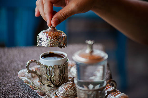 istock Traditional Turkish Copper Coffee Cup on Ancient Stone, Lid Opening 2213880280