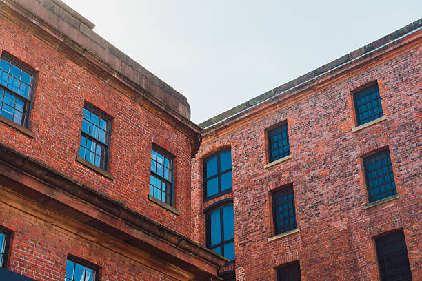 Low angle view of red brick buildings in liverpool, england