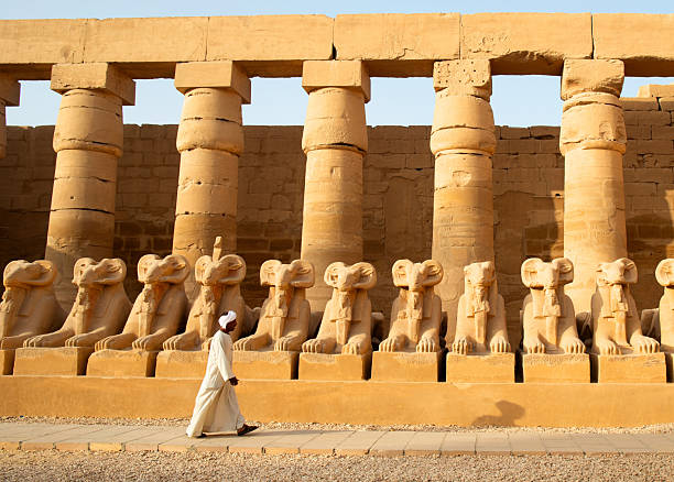 istock Egyptian guide at karnak cultural ruins. 2213881608