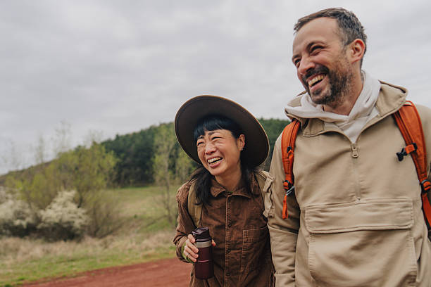 istock Smiling couple enjoying nature walk 2213881839