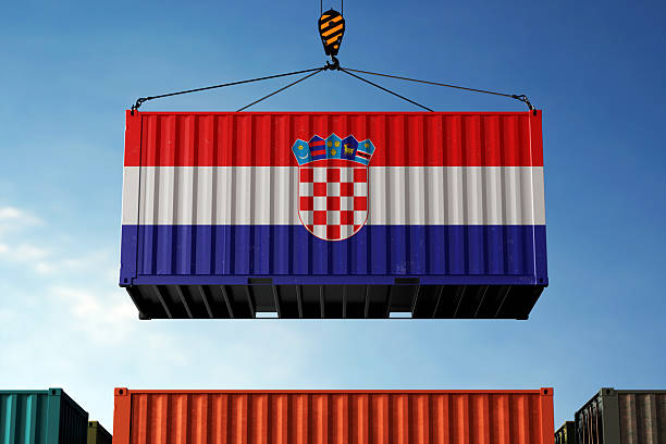 istock Croatia trade cargo container hanging against clouds background 2213882941