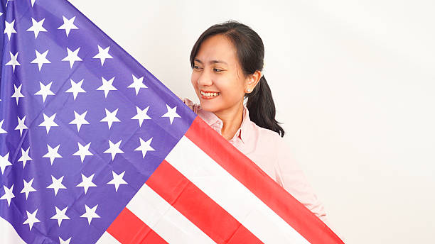 istock Patriotic pose with flag and confident expression white background 2213884453