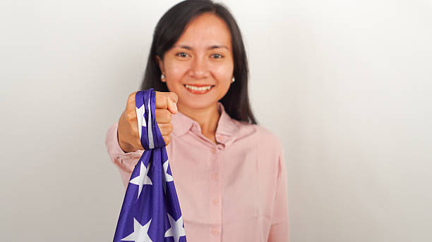 istock Female showing American flag with strong gesture 2213884870