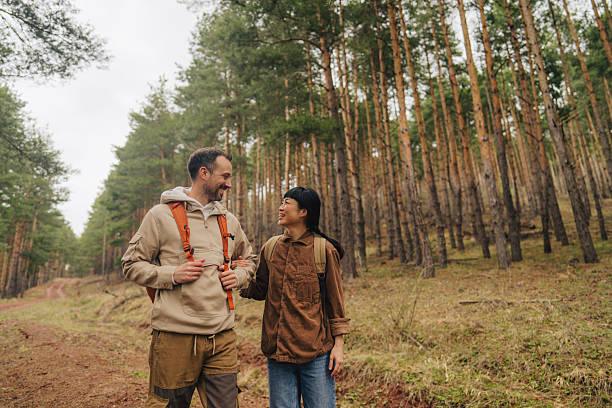 istock Happy couple exploring the woods together 2213885667