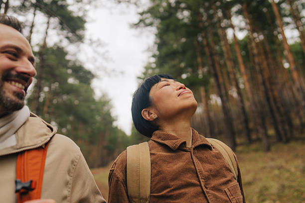 istock Happy couple exploring the woods together 2213886274