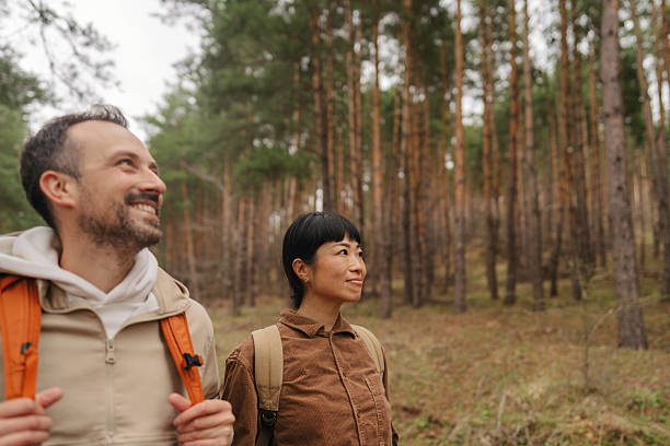 istock Happy couple exploring the woods together 2213886277