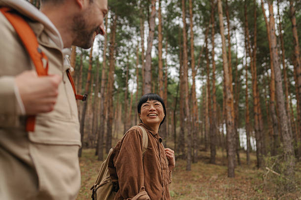 istock Happy couple exploring the woods together 2213886410
