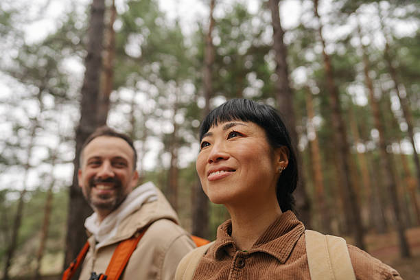 Happy couple exploring the woods together