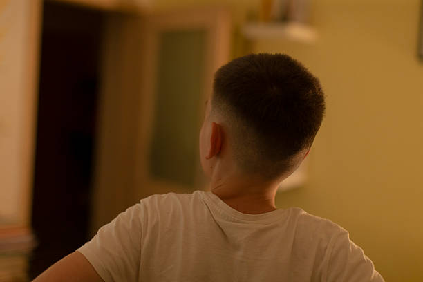 istock A child with a short haircut is found in a cozy indoor setting 2213895833