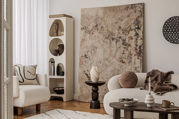 istock Cozy corner with abstract cushion, white armchair and rustic textured wall art. 2213897551