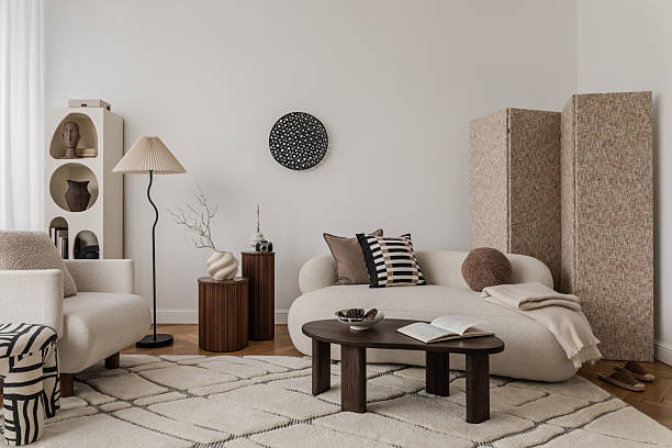 istock Design vignette with sculptural ceramic vases, branches and classic armchair. 2213897560