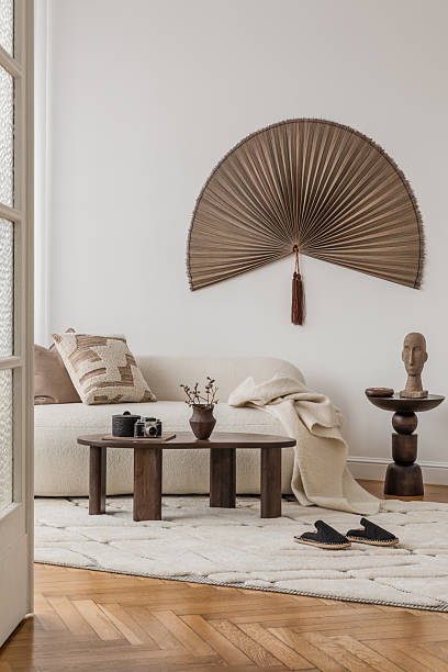 istock Minimalist styling with sculptural vases and geometric forms in a beige room. 2213897633