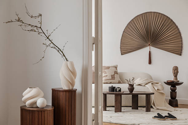 Room view through open doors showcasing sofa console table and curated decorative accents.