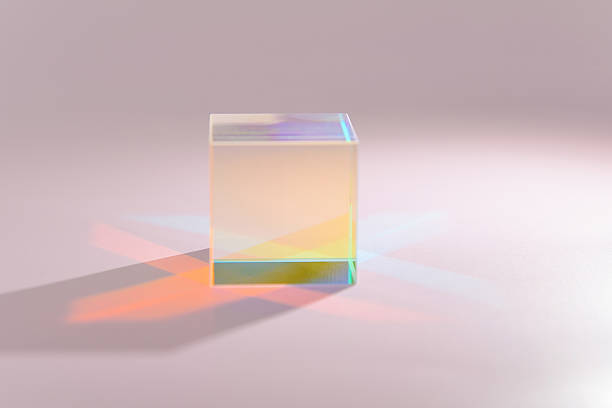 istock Clear prism refracts light, creating a vibrant display of gradient colors 2213897732