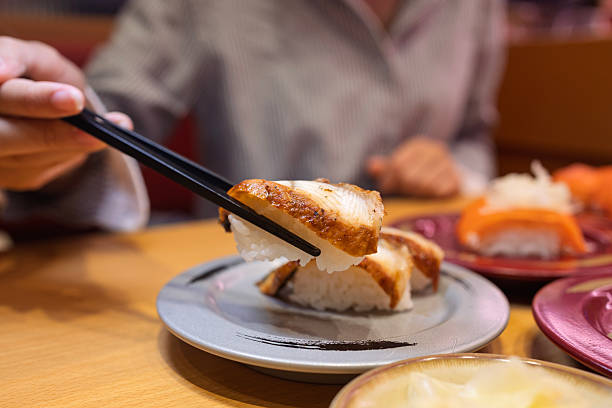 istock Grilled Sushi Nigiri Served with Chopsticks 2213899490