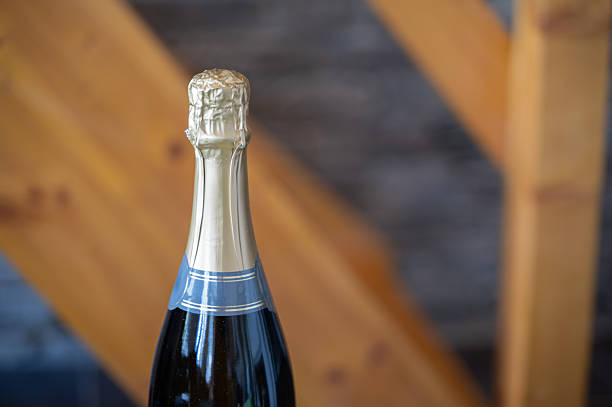 istock An exquisite Champagne bottle featuring a luxurious golden foil top that truly impresses 2213899862