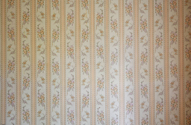 istock Old wallpaper on the wall. Old wallpaper for texture or background. 2213901329