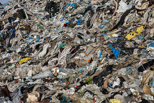 istock A vast pile of mixed waste is visible, showcasing discarded textiles, plastics, and debris. This landfill reflects ongoing environmental challenges 2213902147