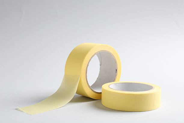 istock Two masking tapes on grey background, closeup 2213902210