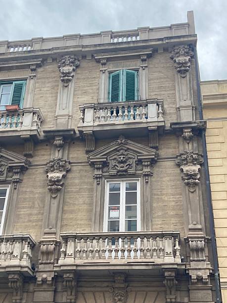 istock Stone balustrate balcony with window pediment and allegorical sculptures 2213902410