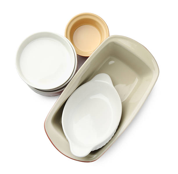 istock Different ceramic casseroles isolated on white, top view. Cooking utensil 2213903029
