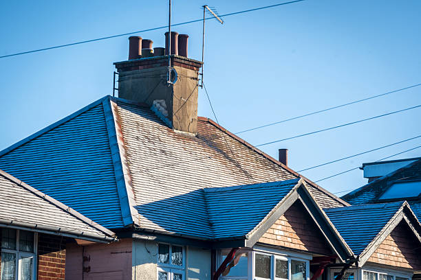 Frost snow covered british house roof in england uk.