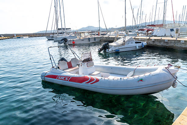 Fethiye, Turkey - August 24, 2021: Inflatable boat powered by outboard electric motor on sea. New technology outboard boat.