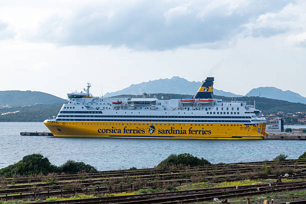 BASTIA, CORSICA, FRANCE - JULY 23, 2019: Cityscape with passenger port and moored Corsica Viktoria ferry ship by Corsica Ferries Sardinia Ferries. Bastia port is the busiest French Mediterranean port.