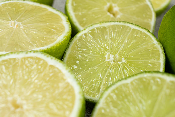 istock Juicy Green Lime Halves in Macro View 2213905029