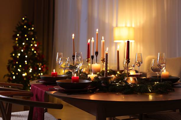 istock Festive table setting in room decorated for Christmas. Bokeh effect 2213905126