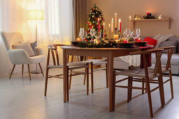 istock Festive table setting in room decorated for Christmas. Bokeh effect 2213905155