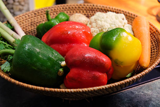 Red and Green Paprika in a wicker basket
