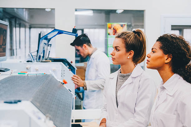 istock Engineers operate pick-and-place machines for PCB assembly. 2213920869