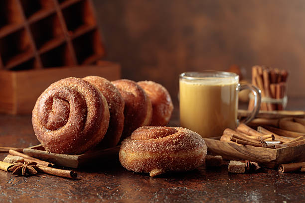 istock Swedish cinnamon rolls and coffee latte on a brown background. 2213922248