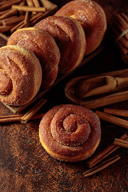 istock Swedish cinnamon rolls on a brown background. 2213922250