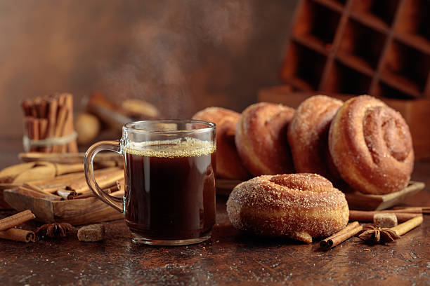istock Swedish cinnamon rolls and mug of black coffee. 2213922256