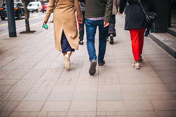 istock Tourists walking on a city sidewalk 2213923668