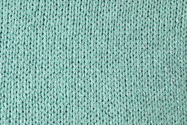 istock Texture of turquoise knitted fabric as background, top view 2213925345