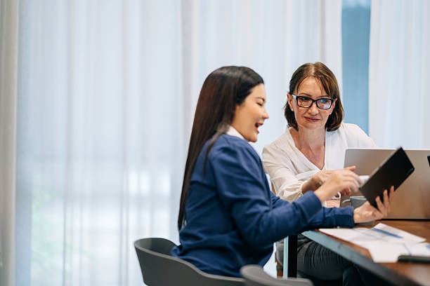 istock Businesswomen in Discussion During Office Collaboration 2213925840