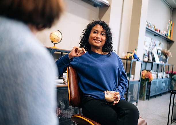 istock Female Colleagues Connecting Over Coffee in Lounge 2213926019