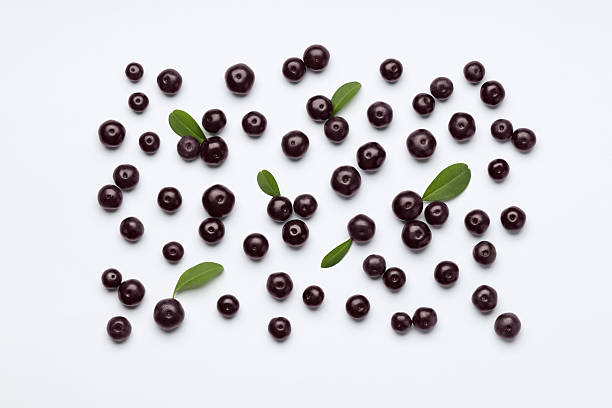 istock Ripe acai berries and leaves on white background, flat lay 2213926629