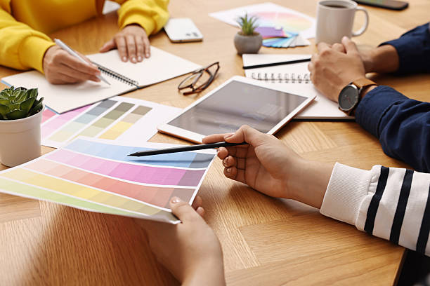 istock Group of designers working together at table, closeup 2213927797