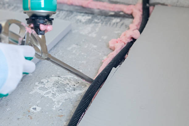 istock Applying mounting foam to floor insulation channel 2213927872