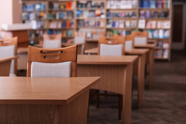 istock Desks and chairs in public library room 2213932345