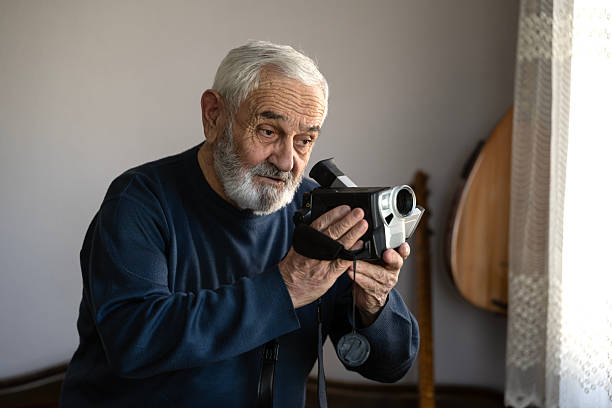 istock Portrait of a man with a video camera 2213934564