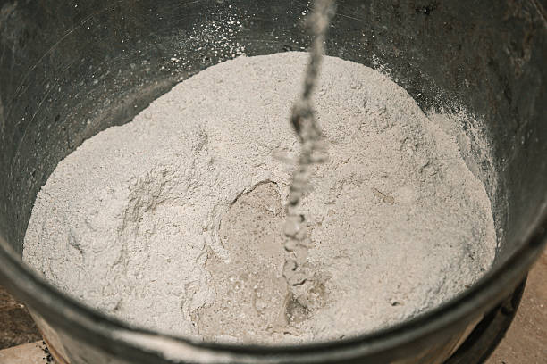 istock Unreal putty mixing at the initial stage. Water and putty. Texture, gray 2213938761